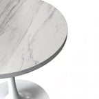 Table à manger ronde avec plateau en résine et piètement colonne en acier blanc